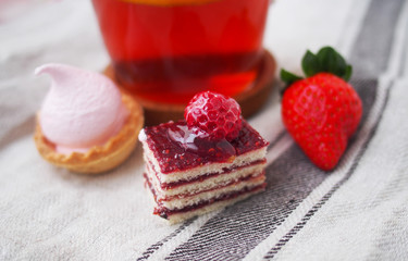 Sweet bar on summer morning. Layer cakes with protein cream and fresh cherry and berries on a cake.
