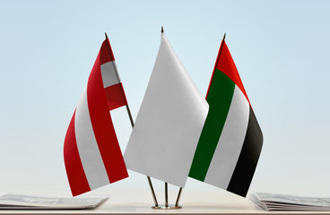 Flags of Austria and UAE with a white flag in the middle