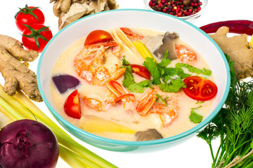 Popular Thai Tom yam soup with prawns and vegetables on white background