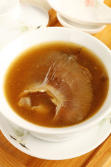 Closeup of a bowl of shark fin soup.        