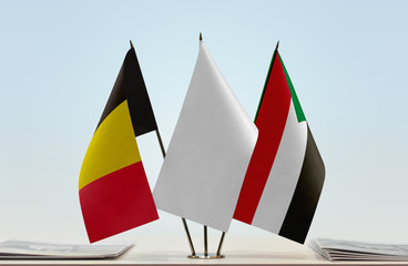 Flags of Belgium and Sudan with a white flag in the middle