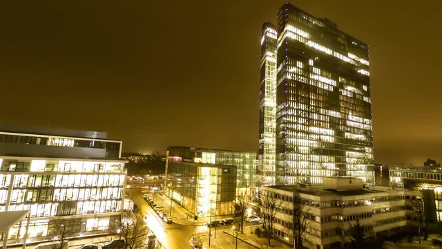 Aerial time lapse of Business Skyscrapers lights going on and off