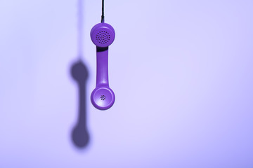 hanging purple telephone handset, ultra violet trend