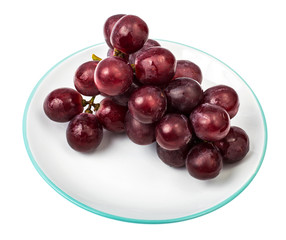 Bunch of red grapes on plate