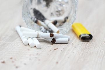 cigarette butts in glass containers