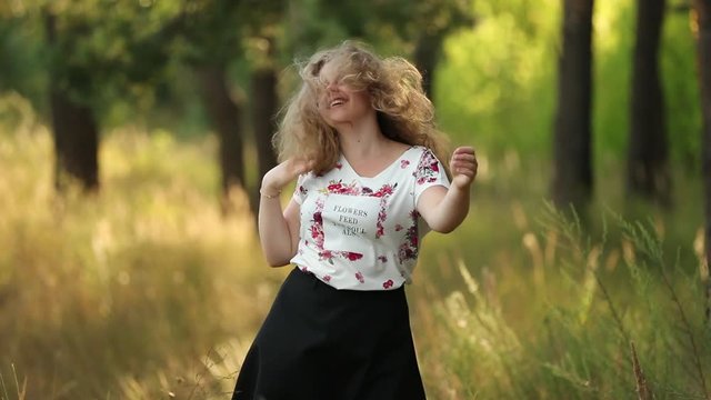 Single Young Pretty Plus Size Caucasian Happy Smiling Laughing Girl Woman In White T-shirt, Dancing In Summer Green Forest. Fun Enjoy Outdoor Summer Nature. Slo-mo, Slow Motion, Slo-mo, Slow-mo