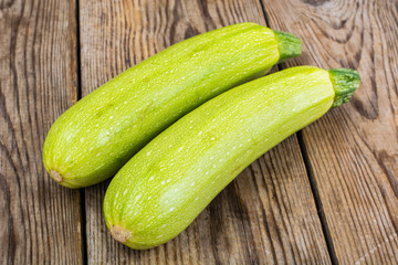 Two young zucchini  on  wooden