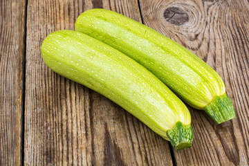 Two young zucchini  on  wooden