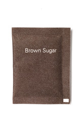 Brown sugar packet on white background 