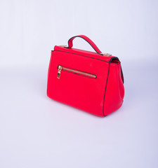bag or red colour woman bag on background.