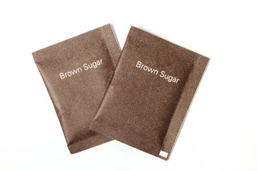Brown sugar packet on white background 