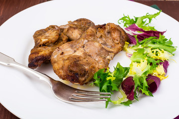 Concept of protein-carbohydrate nutrition. Chicken meat with lettuce
