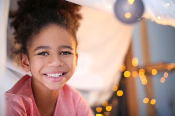 Cute African American girl at home