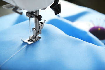 Sewing machine with fabric and thread, closeup