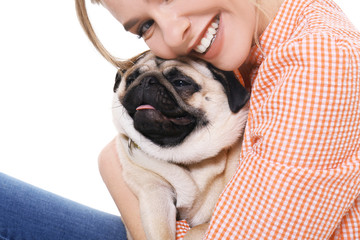 Young woman with cute pug dog on white background. Pet adoption