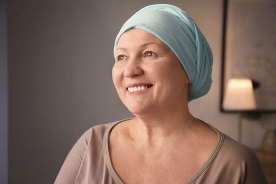 Mature Woman With Cancer In Headscarf Indoors