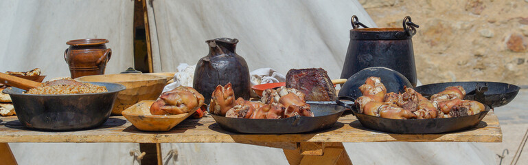 Fried pork knuckles on metal plates. Traditional German food.