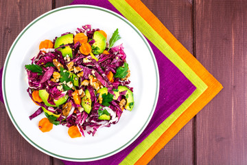 Healthy food. Salad of fresh vegetables with avocados and nuts