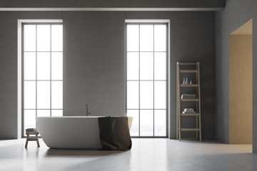 Fototapeta na wymiar White tub in a gray bathroom with white floor