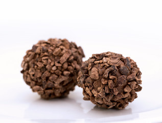 Closeup photo of chocolate bonbon on white background