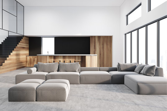 White living room and kitchen, gray sofa
