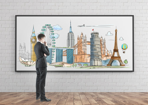 Businessman looking at sights on a whiteboard