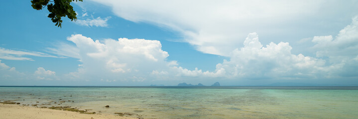 Panoramic sea landscape with clouds on horizon, shot from small tropical island, Thailand.