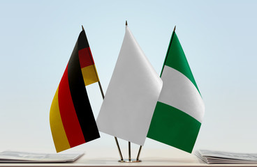 Flags of Germany and Nigeria with a white flag in the middle