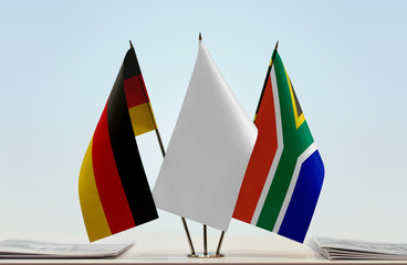 Flags of Germany and Republic of South Africa with a white flag in the middle