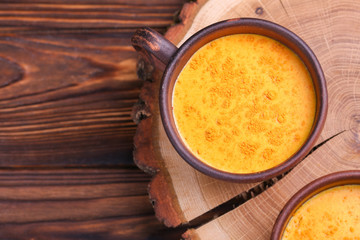 Indian turmeric milk with saffron, cardamom and turmeric. Copyspace