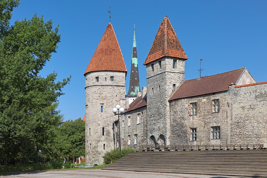 Tallinn, Estonia. Loewenschede Tower and Nunnadetagune Tower (Tower behind Nuns) of the medieval city wall, and spire of St. Olaf's Church between them.