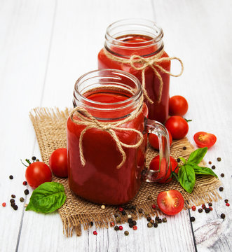 Jars with tomato juice