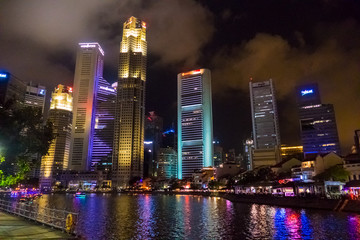 Singapore City, Singapore - 07 19 2015: Singapore Reflection Of Modern High Skyscraper Buildings And Its River At Colorful Night.