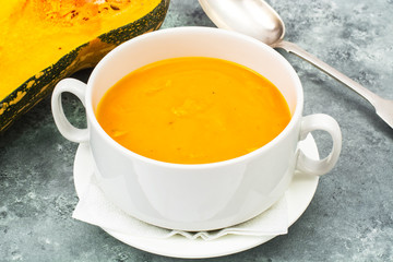Cream soup of carrots, pumpkins, vegetables in white soup