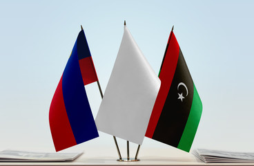 Flags of Liechtenstein and Libya with a white flag in the middle