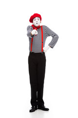 grimacing mime pointing on camera isolated on white