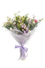 Bouquet of lilac, violet, eustoma and eucalyptus. Delicate and lightweight, packed and with ribbon. A holiday, a gift for a woman. Big and smart. Side view. Isolated.