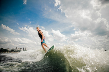athletic surfer rides the waves