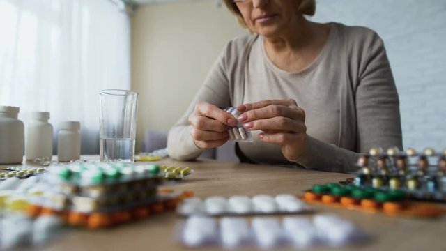 Addicted lady feeling good after drinking pills, illness symptoms, hypochondria