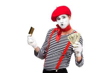 sad mime holding credit card and cash isolated on white