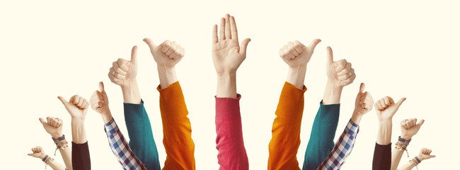 Fototapeta premium People showing thumbs raised up