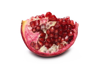 Cut pomegranate, piece with seeds isolated on white background