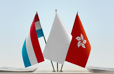 Flags of Netherlands and Hong Kong with a white flag in the middle