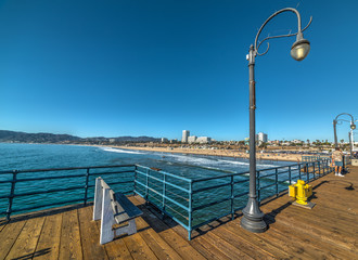 Naklejka premium People in Santa Monica wooden pier