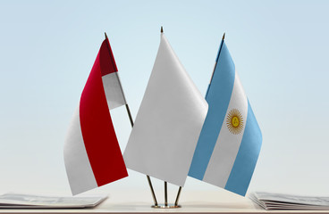 Flags of Monaco and Argentina with a white flag in the middle