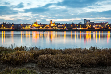 Fototapeta na wymiar Night view on the Vistula river and church of the Visitation of the Virgin Mary in Warsaw, Poland