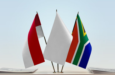 Flags of Monaco and Republic of South Africa with a white flag in the middle