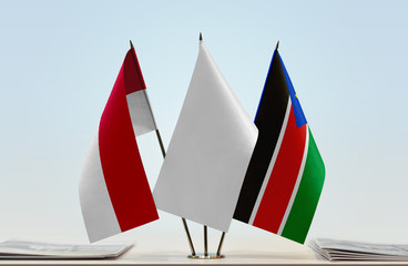 Flags of Monaco and South Sudan with a white flag in the middle