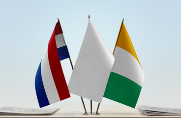 Flags of Netherlands and Ivory Coast with a white flag in the middle