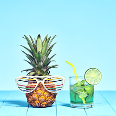 Tropical Pineapple Hipster with Cocktail on Beach. Bright Summer Color. Trendy fashion Style. Hot summer Vibes. Creative Art. Fun party Mood. Minimal